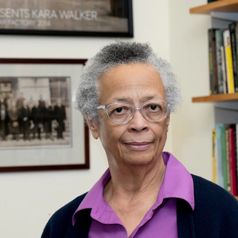 Sue Houchins in her Pettengill Hall office with a photograph that includes her distinguished father, an economist and a lawyer, Joseph Houchins Jr.

“Negroes in Roosevelt’s ‘Black Cabinet” represented highly accomplished specialists in a variety of fields. This group, photographed in 1938 by Addison Scurlock, the famed Washington, D.C., documentarian of the African American bourgeoisie, are (from left, front row): Dr. Ambrose Caliver, Department of the Interior; Dr. Roscoe C. Brown, Public Health Service; Dr. Robert C. Weaver, Housing Authority; Joseph H. Evan, Farm Security Administration; Dr. Frank Horne (the poet), Housing Authority; Mary McLeod Bethune, National Youth Administration; Lieutenant Lawrence A. Oxley, Department of Labor; Dr. William J. Thompkins, Recorder of Deeds; Charles E. Hall, Department of Commerce; William I Houston, Department of Justice; Ralph E. Mizelle, Post Office.

(From left, back row): Dewey R. Jones, Department of the Interior; Edgar Brown (tennis star), Civilian Conservation Corps; J. Parker Prescott, Housing Authority; Edward H. Lawson Jr., Works Project Administration; Arthur Weiseger, Department of Labor; Alfred Edgar Smith, Works Projects; Henry A. Hunt, Farm Credit Administration; John W. Whitten, Works Projects; and Joseph R. Houchins, Department of Commerce.

Others not pictured: William H. Hastie, attorney, Department of the Interior; Eugene Kinckle Jones, Department of Commerce; and William J. Trent, Federal Works Agency.


Liberal Franklin Roosevelt’s 1932 election led to the creation of the New Deal and a switch in allegiance by black voters from the Republican to the Democratic party. Roosevelt’s administration led to the appointments of many African American advisers in various government agencies to address the manifold problems created by the Great Depression.