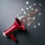 AI image: red megaphone with silver stars and words Good News!