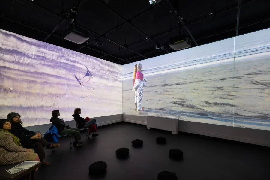 Viewers watching a video in the Immersive Media Studio