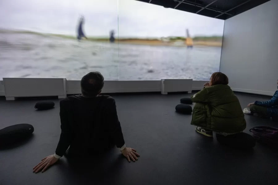 Viewers watching a video in the Immersive Media Studio