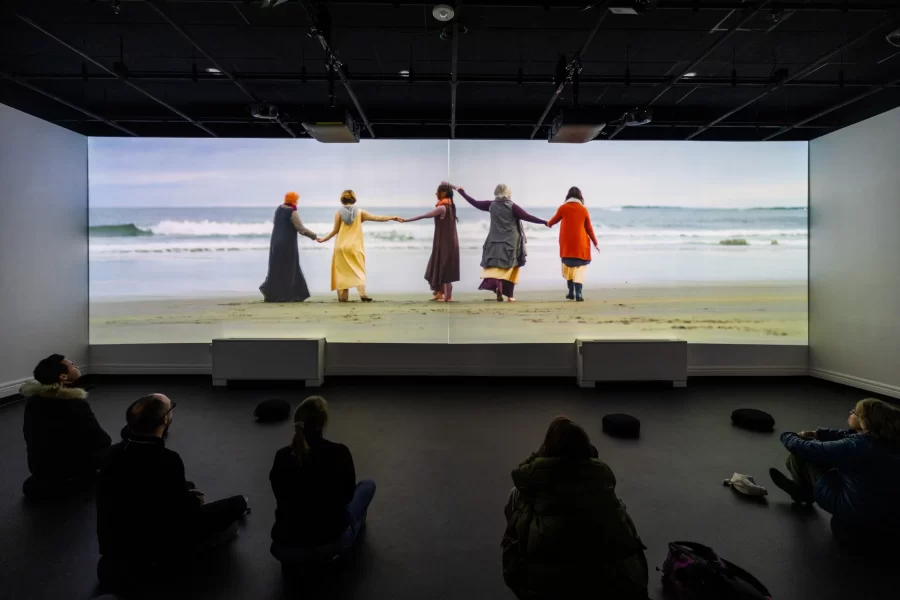 Viewers watching a video in the Immersive Media Studio