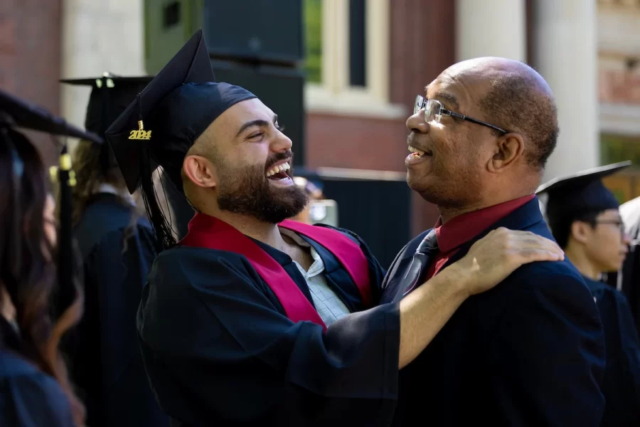 Dean Reese greets a graduate