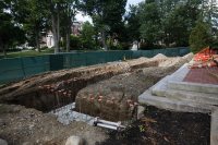 Shown on July 6, 2018, this concrete footer will support a new extension on the porch of Coram Library. (Theophil Syslo/Bates College)