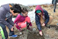 Bates and Togiak students learn the basics of excavation together during the 2018 experiential learning week. (Kristen Barnett)