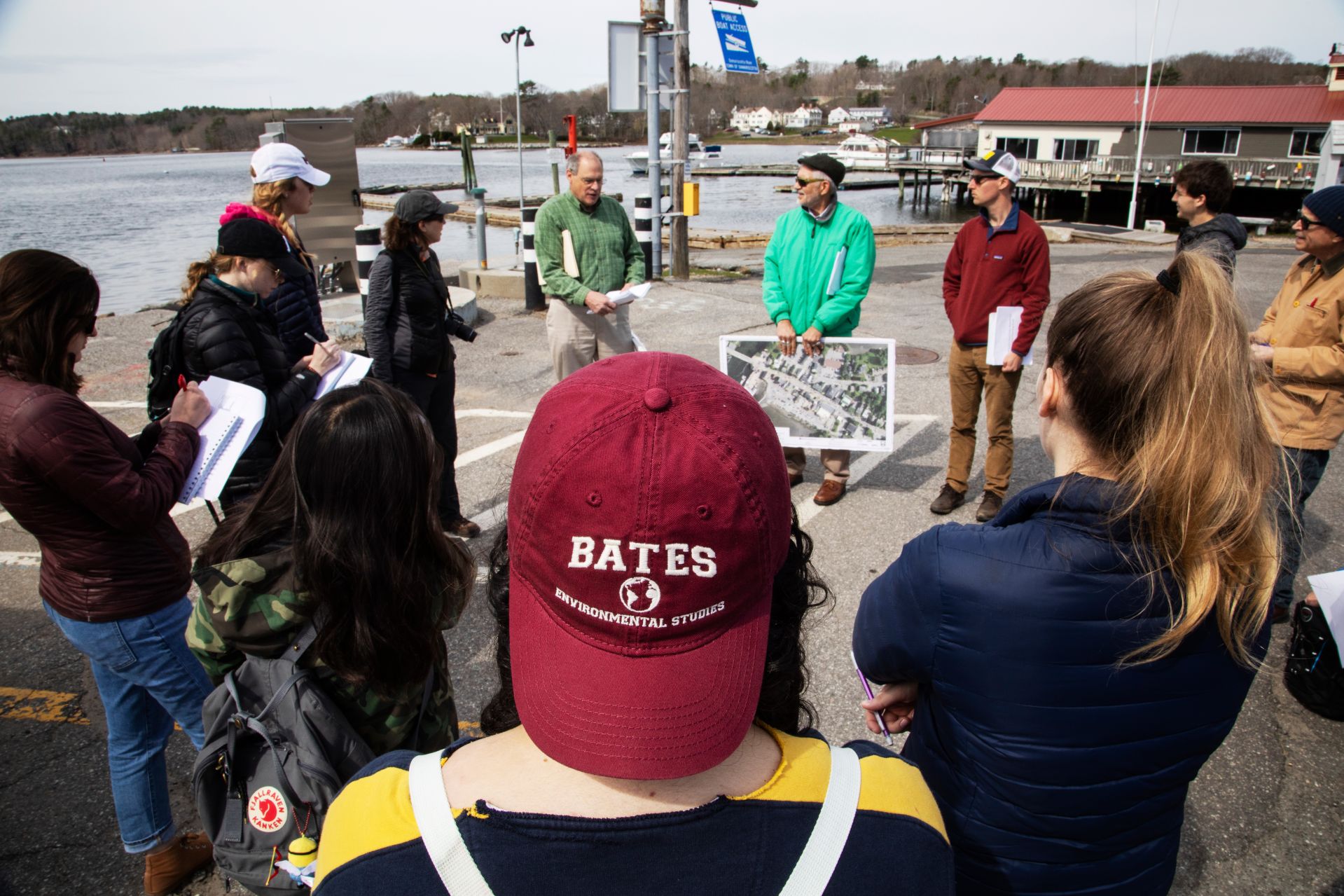 Bates students hear about flood response planning from Damariscotta Town Manager Matt Lutkus, center left, and former county planner Bob Faunce, center right, during their May 1 visit. (Theophil Syslo/Bates College)