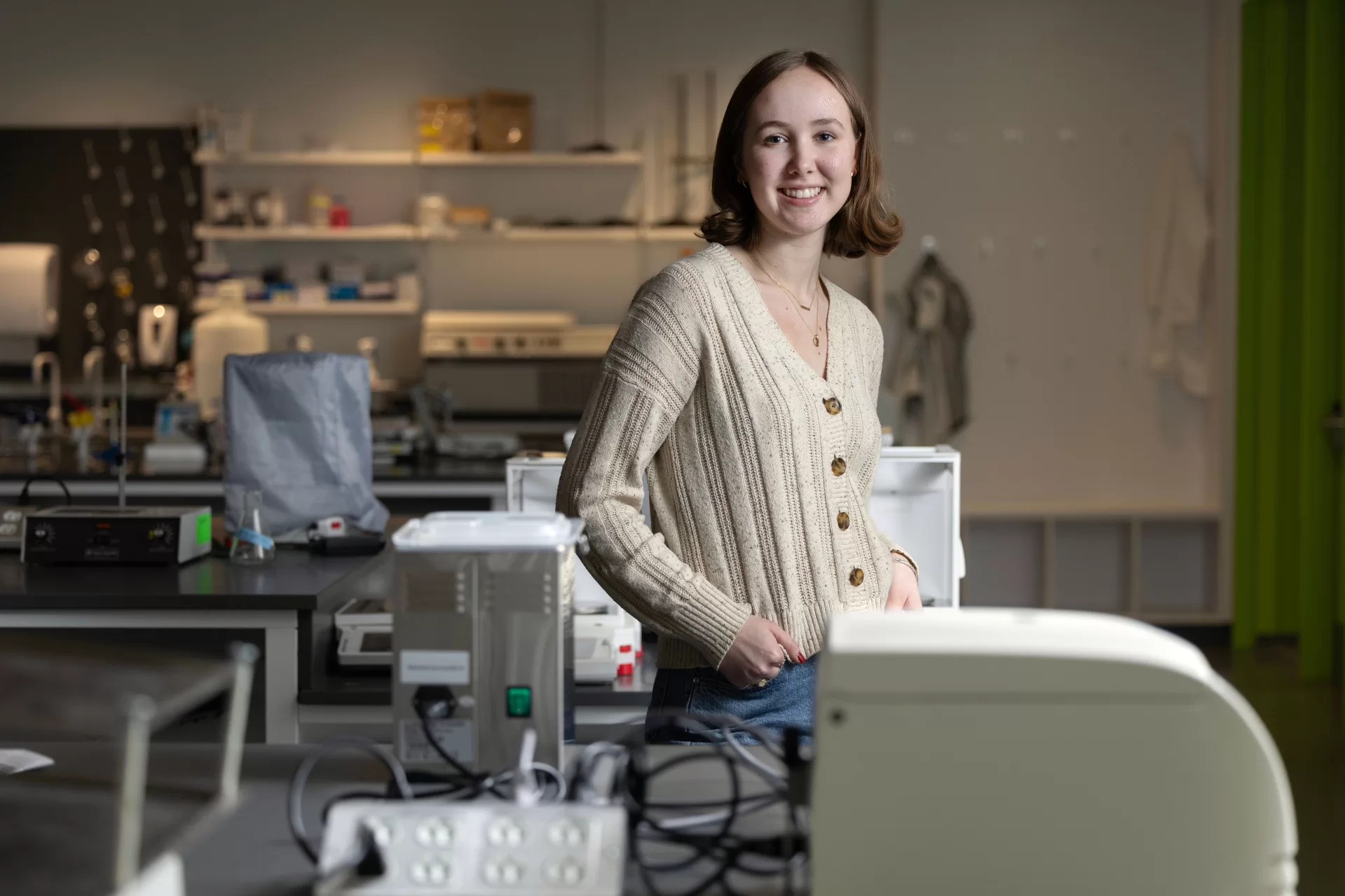 Emily Scarrow’25 of Washington, DC poses in the Bonney Science Center’s biochemistry lab for a story about her being named as a 2024winner of the Barry Goldwater Scholarship.