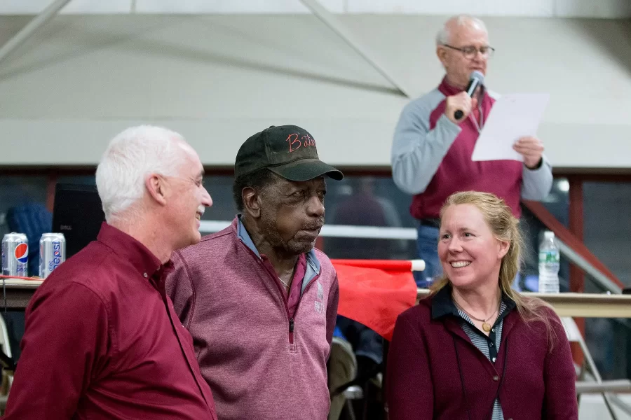 Feb. 3, 2018: Fereshetian, displaying his trademark mix of ebullience, intensity, and creativity, at the Maine State Track meeting with now retired equipment manager Jim Taylor (center) and former Bates coaching colleague Jay Hartshorn. In background is Al Harvie '65, meet announcer. (Phyllis Graber Jensen/Bates College)
