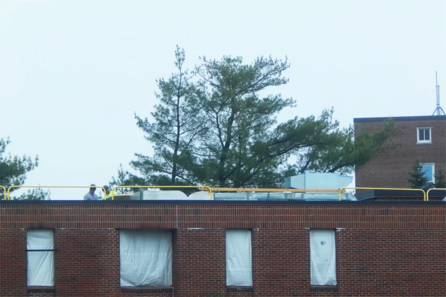 Seen from the bleachers at John Bertram Hall, a new HVAC machine on the roof of 96 Campus Avenue is visible to the right of center. (Doug Hubley/Bates College)