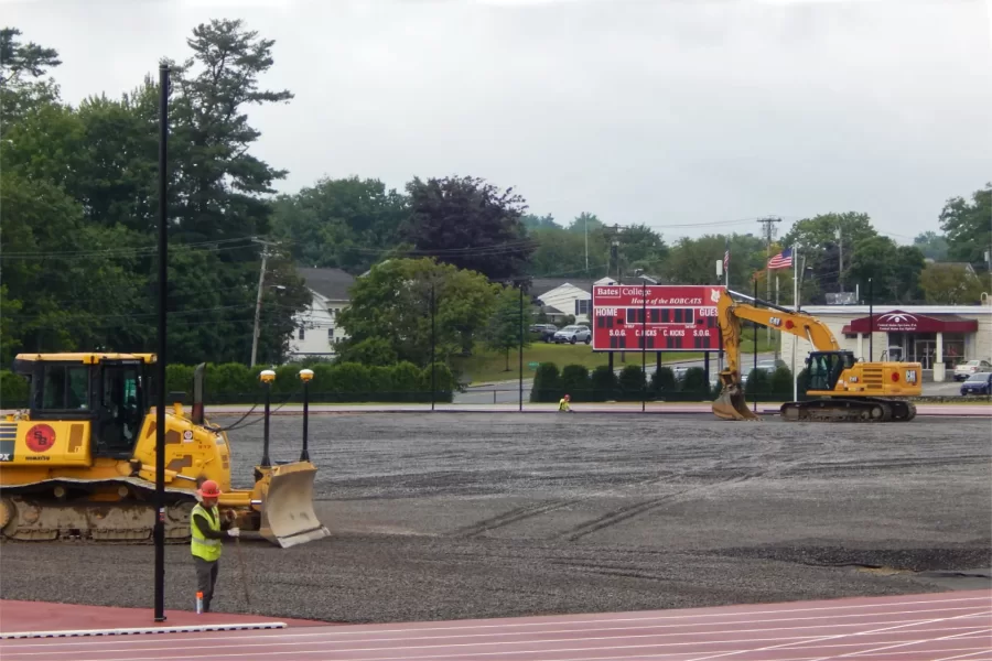 A Shaw Bros. team works on the crushed stone subgrade  at Russell Street Field in preparation for the placement of artificial turf. (Doug Hubley/Bates College)