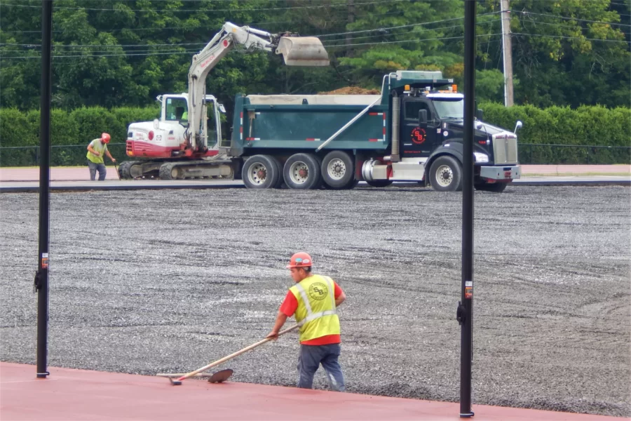 Men and machines prepare the crushed-stone subgrade at Russell Street Field. (Doug Hubley/Bates College)