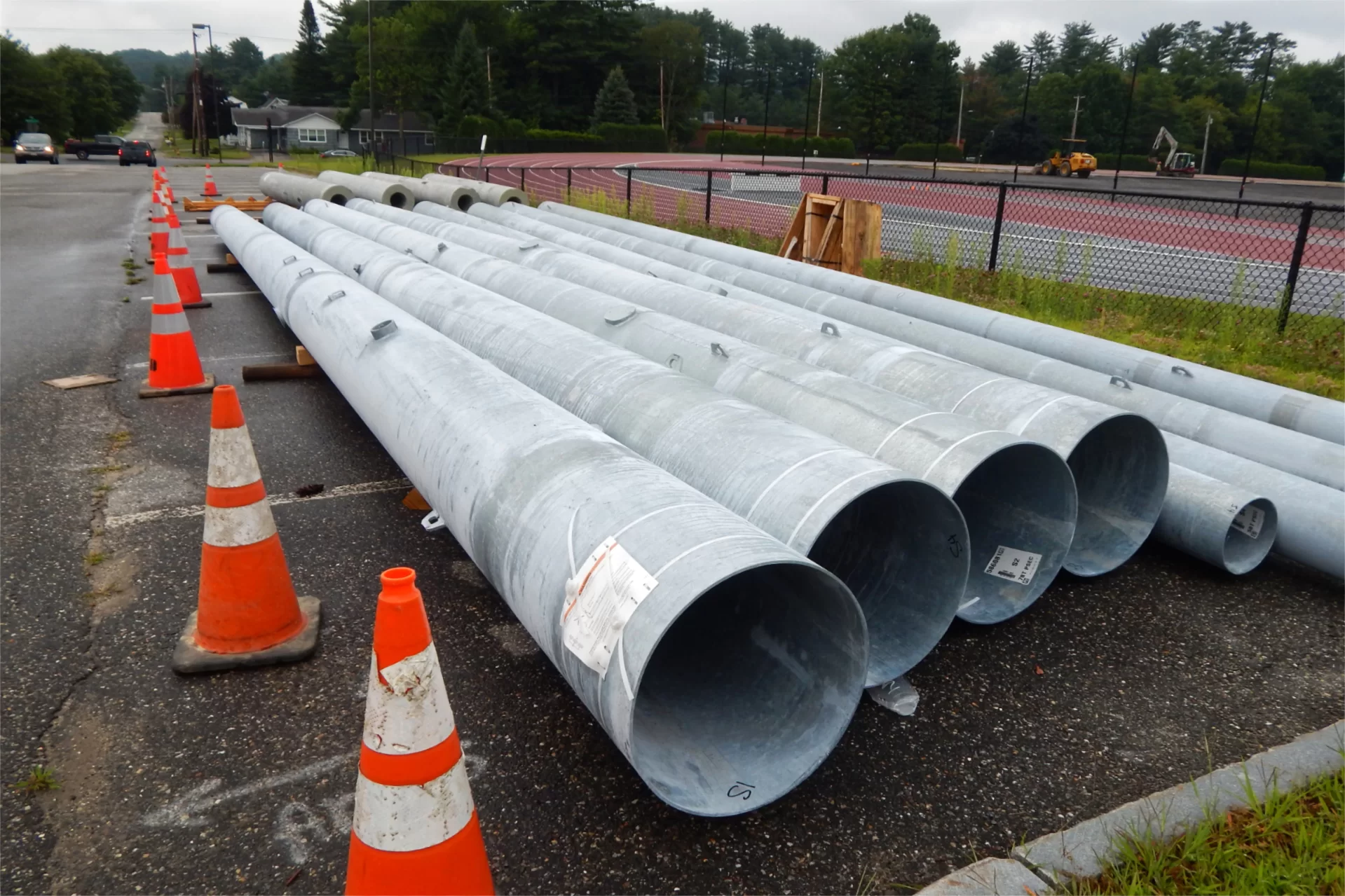 Poles for new lighting at Russell Street Field are shown on July 30, awaiting installation as part of field improvements. (Doug Hubley/Bates College)