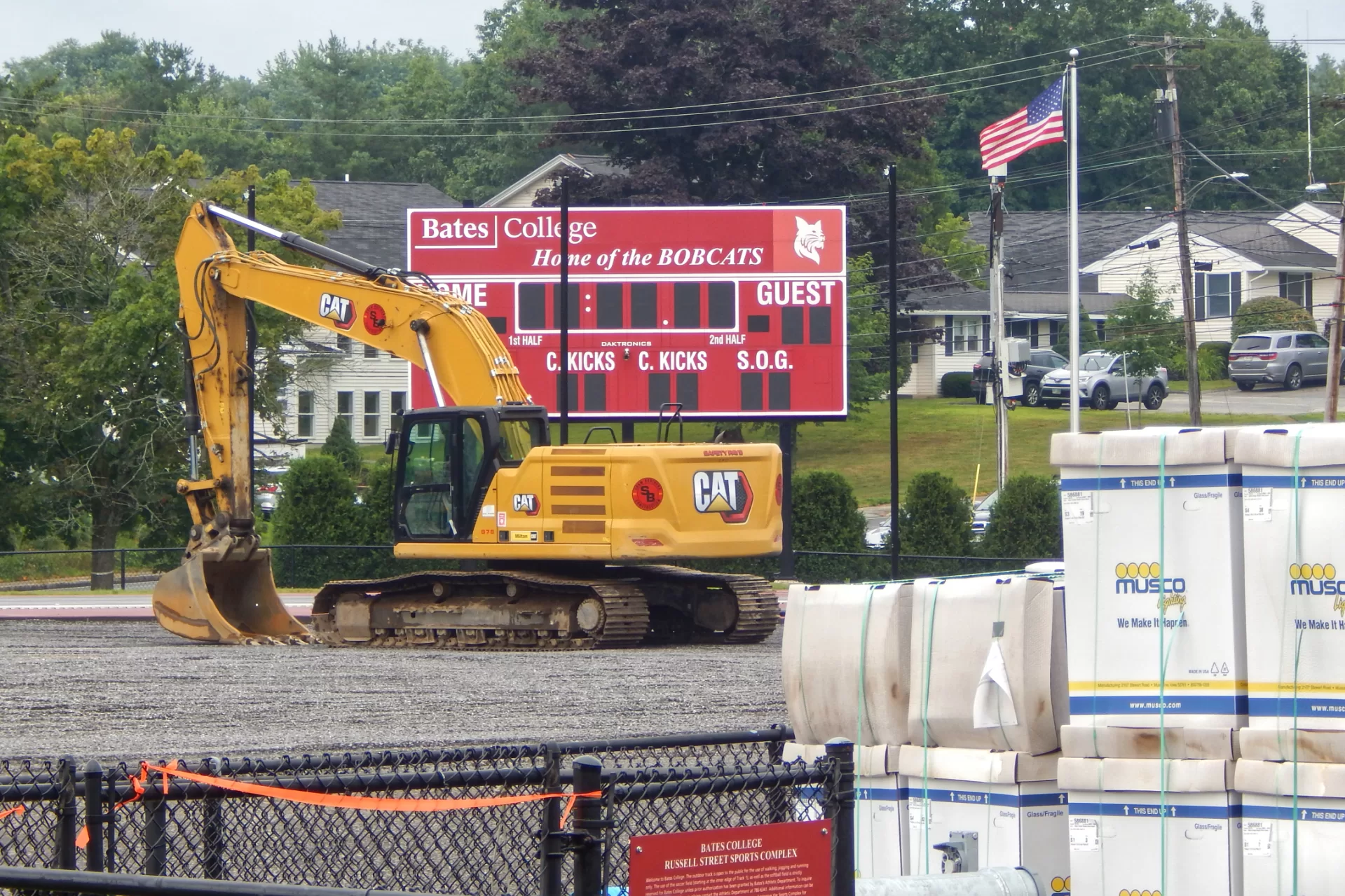 A picture is worth a thousand Campus Construction Updates: Telling the story of this summer’s Russell Street Field renovations, this July 30 image shows the subgrade for new artiificial turf soon to be installed, and boxes of new Musco field lights. (Doug Hubley/Bates College)