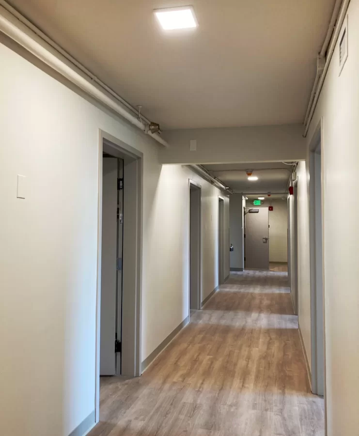 In a month this newly refurbished third-floor corridor in 96 Campus Avenue will be busy with student residents. (Doug Hubley/Bates College)