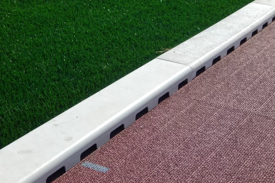 To the left of the white curb at Russell Street Field is the brand-new FieldTurf soccer pitch, and at right is the Mondo track surface installed in 2022. (Doug Hubley/Bates College)