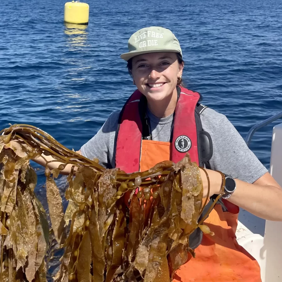 student holding kelp