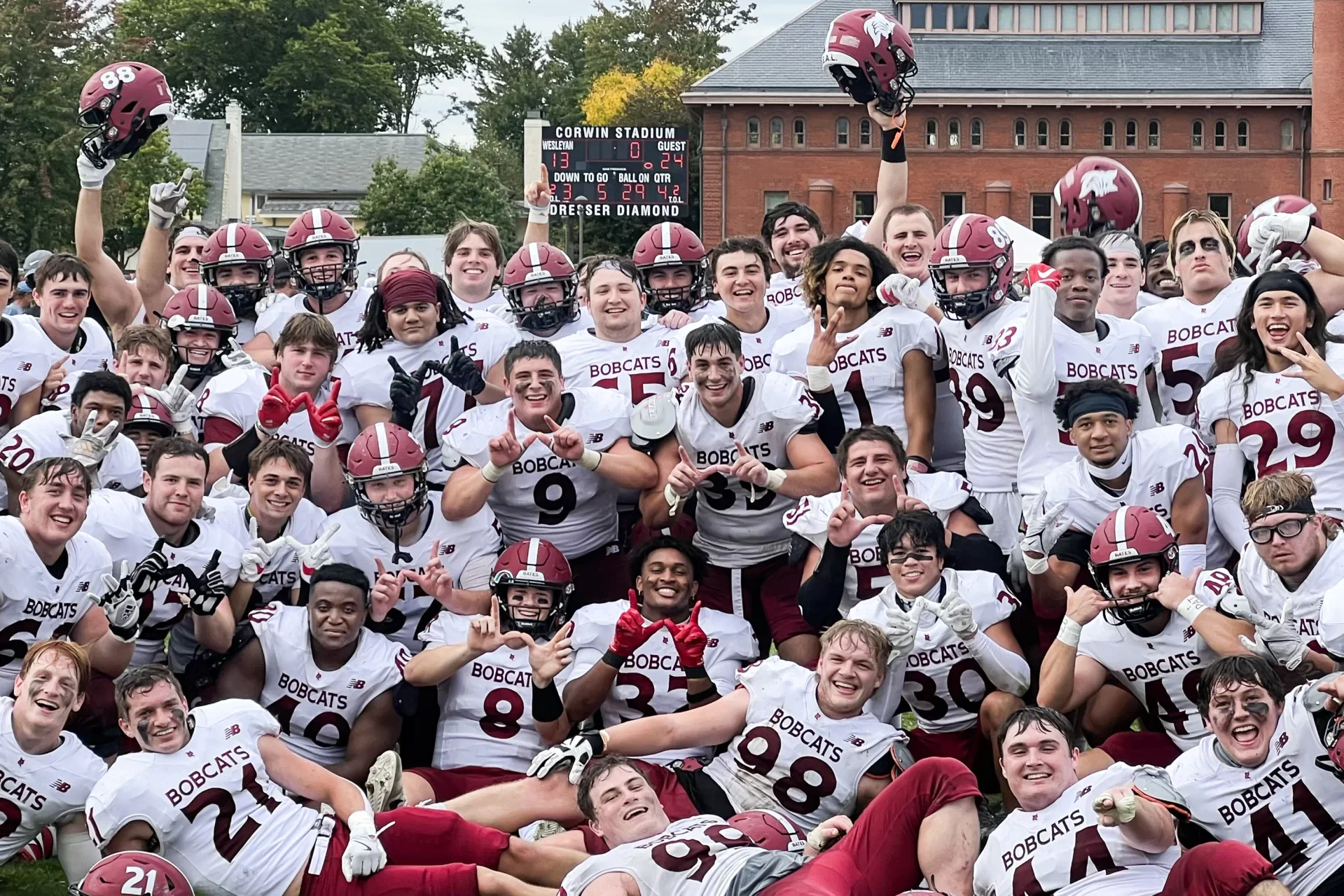 group of laughing and cheering football players