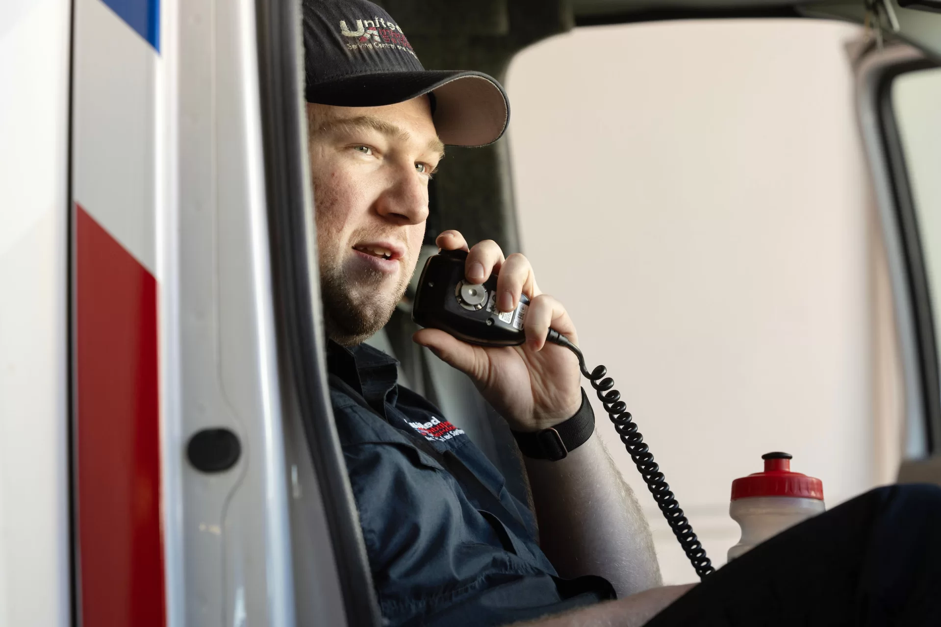 Bates EMS co-chief Ned Friedman ’24 of Park City, Utah, and Noah Bachner ’25 of Weston, Conn., work their overlapping shifts on Sunday, March 31, at Lewiston’s United Ambulance on Russell Street. Shadowing Ned (with the fuller beard and mustache) for the day is first-year Maggie Gill of Tenants Harbor, Maine. Pictured also is EMT Dakota Hern in the United kitchen.