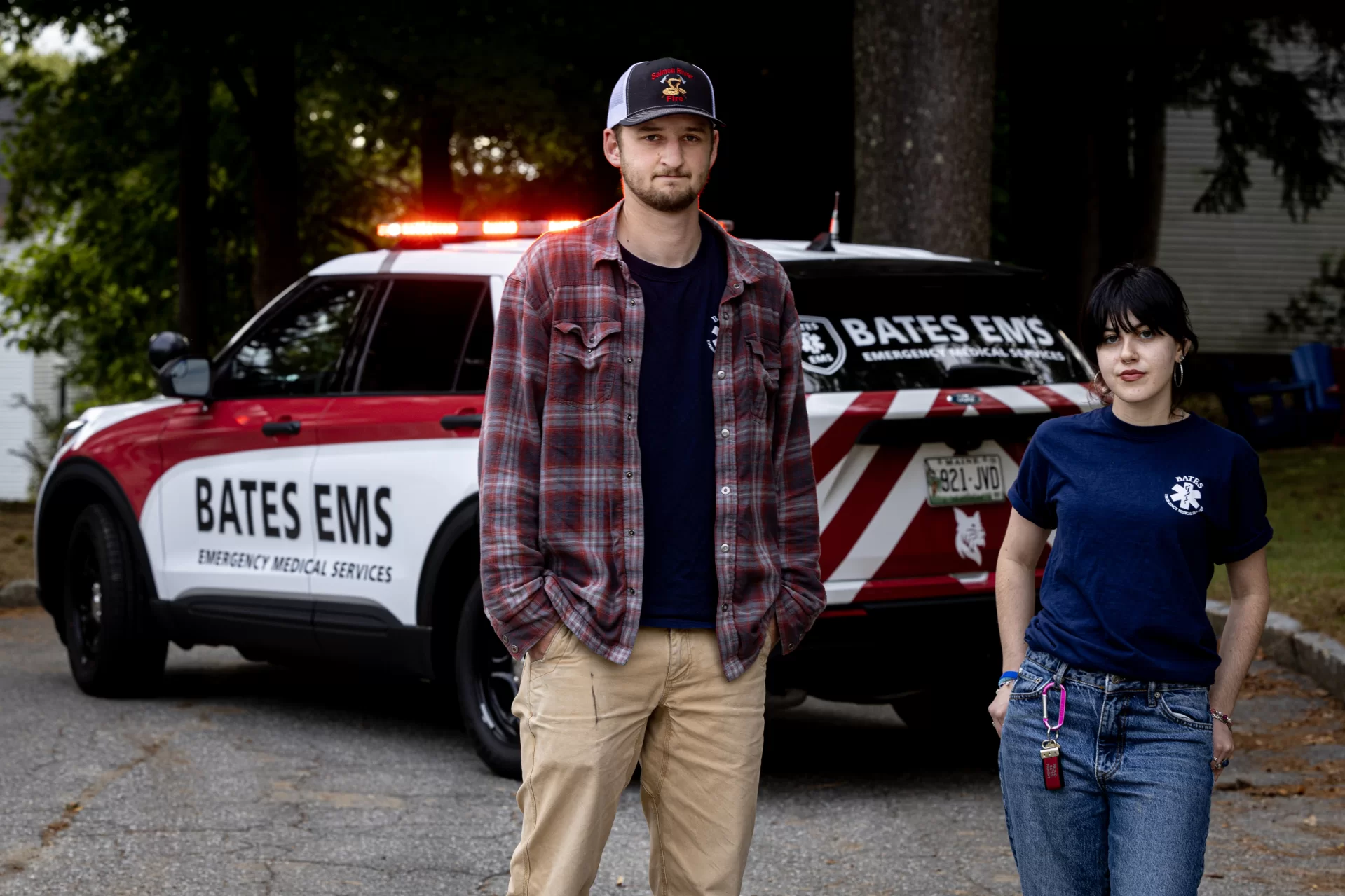 Aoife Spiesel ’26 of South Orange, N.J.,and Noach Bachner ’25 of Weston, Conn., co-presidents of Bates EMS, pose with the organization’s new vehicle in the parking lot behind Campus Safety.