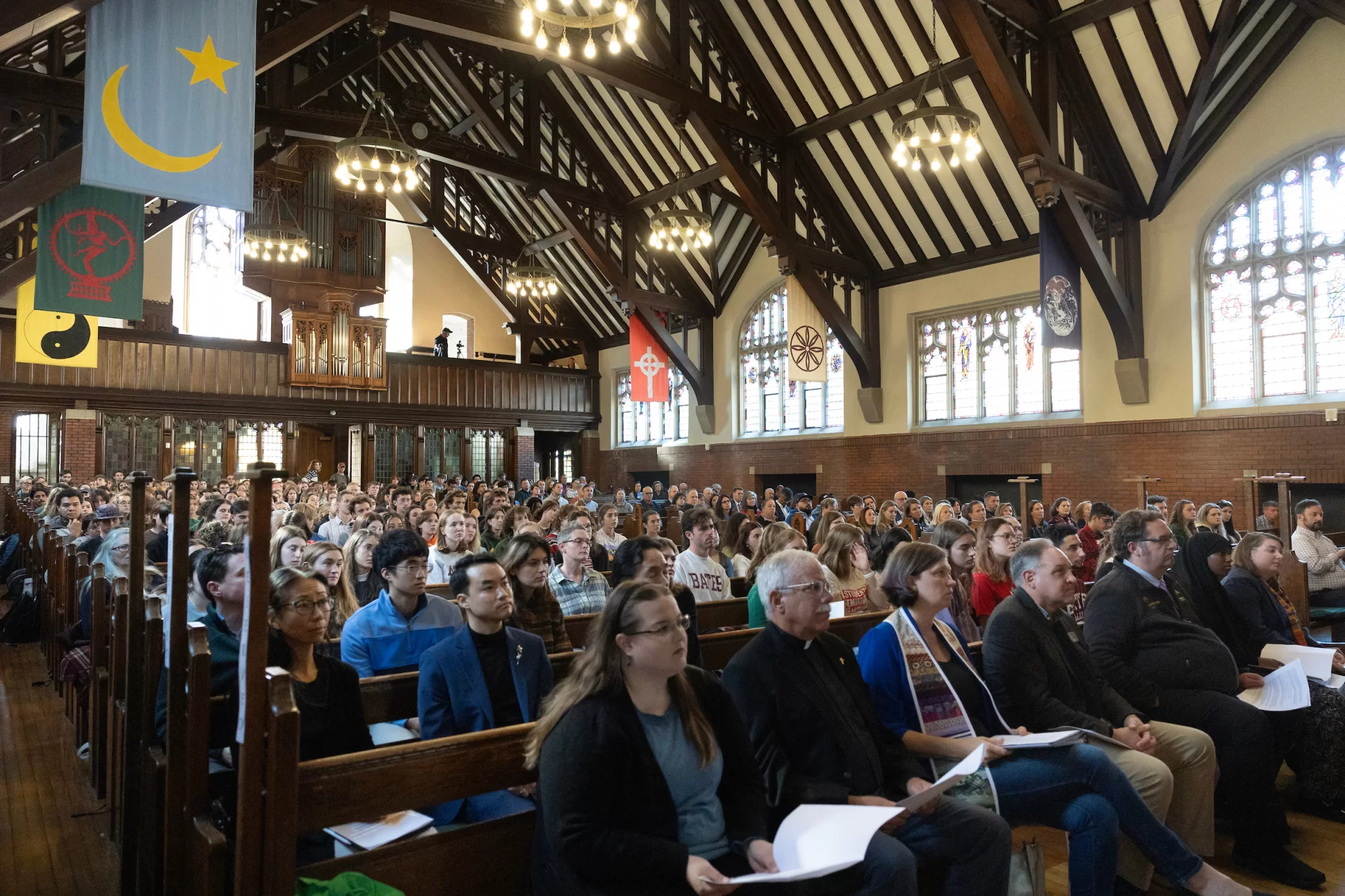 The Bates community gathered at noon on Oct. 25, 2024, in Gomes Chapel for a Remembrance Service one year after the mass shootings in Lewiston. (Phyllis Graber Jensen/Bates College)