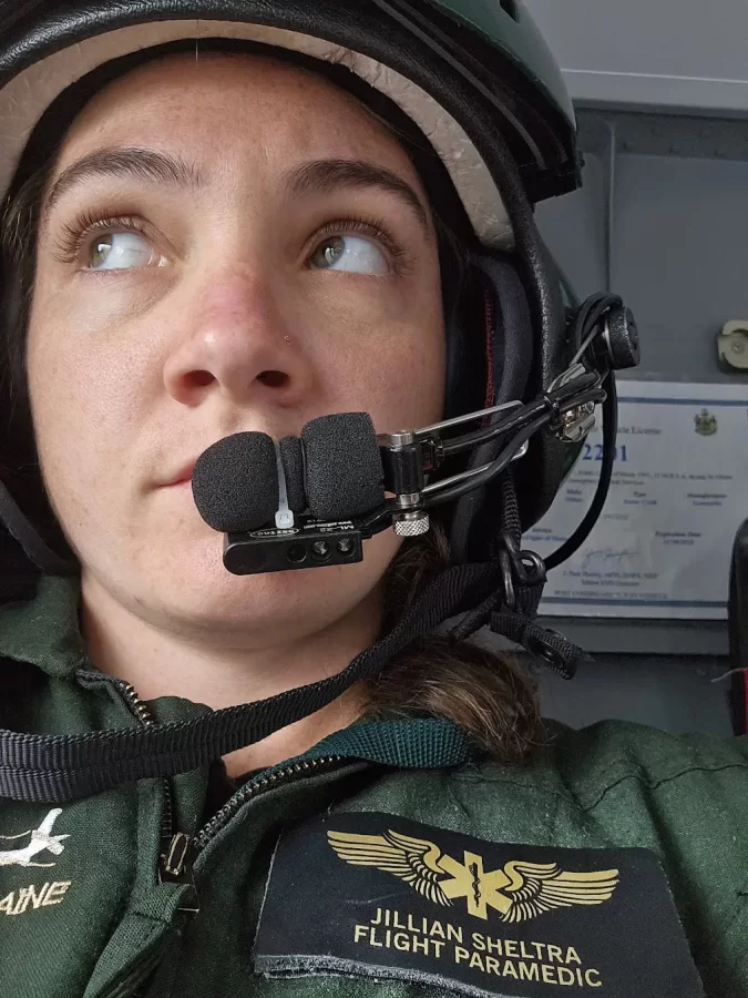 woman in helicopter with headgear