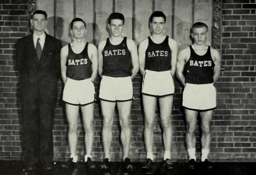 track team posing with coach