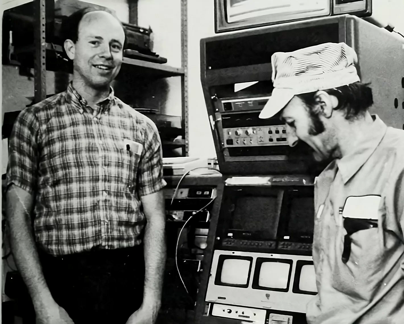 Two men in vintage photo with television equipment