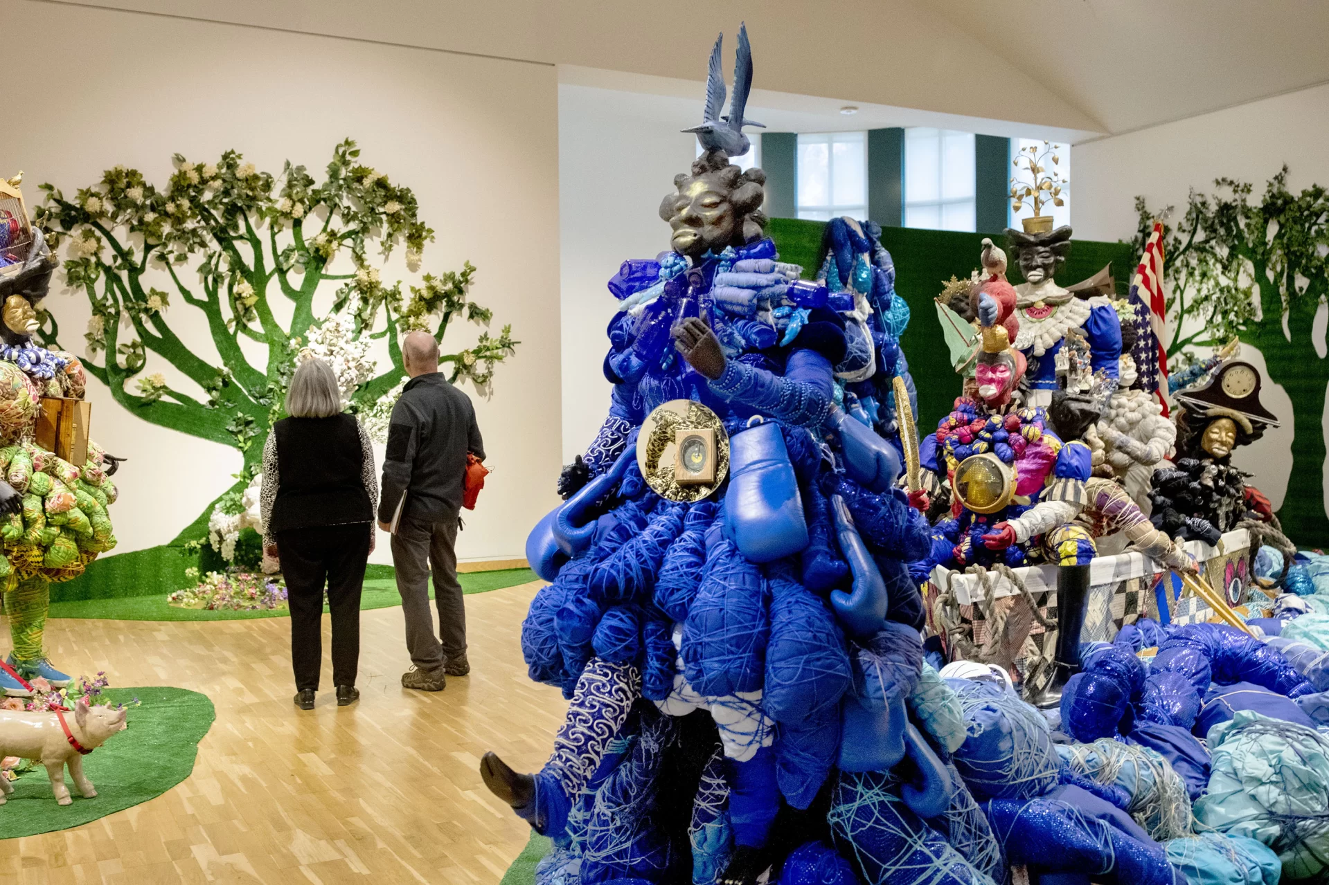 During a visit to Bates College, students from the Tripp Middle School in Turner stop for a tour of the Bates Museum of Art, where they view two exhibitions on display.

Upstairs:  "Vanessa German:Miracles and Glory Abound" (October 25, 2019 – March 28, 2020)

Downstairs: "Ralph Eugene Meatyard:
Stages for Being (October 25, 2019 – March 28, 2020)

Louise Ouillette, Bates Museum of Art attendant, and Tony Leavitt, a science teacher at the Tripp Middle School, takes a closer look at Vanessa German's art work in the Upper Gallery of the Museum.