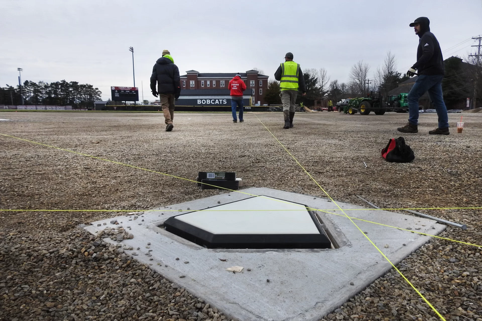 Home plate at Leahey Field. Strings extended to the other bases will guide the correct placement of artificial turf.