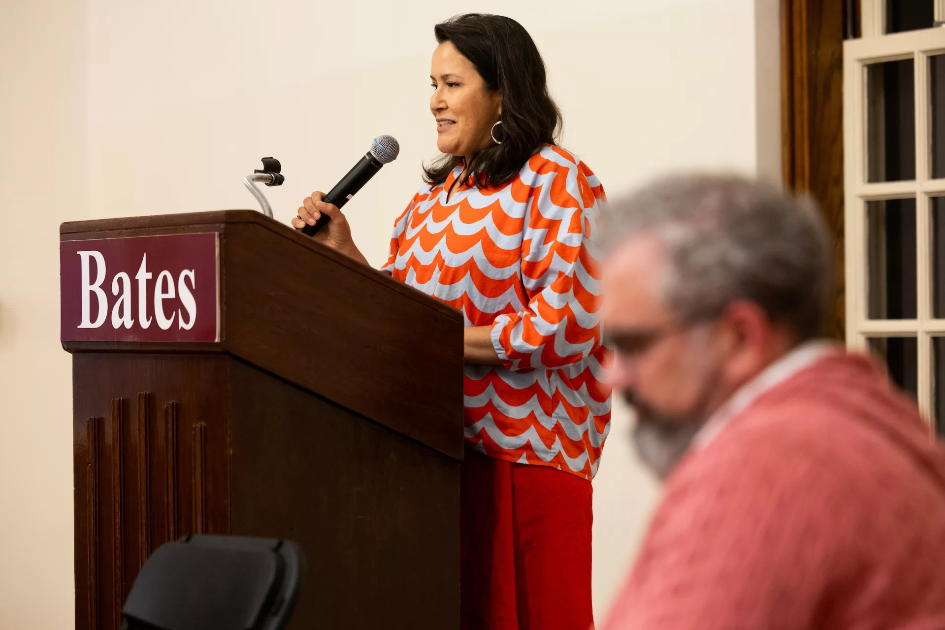 woman speaking at a lectern