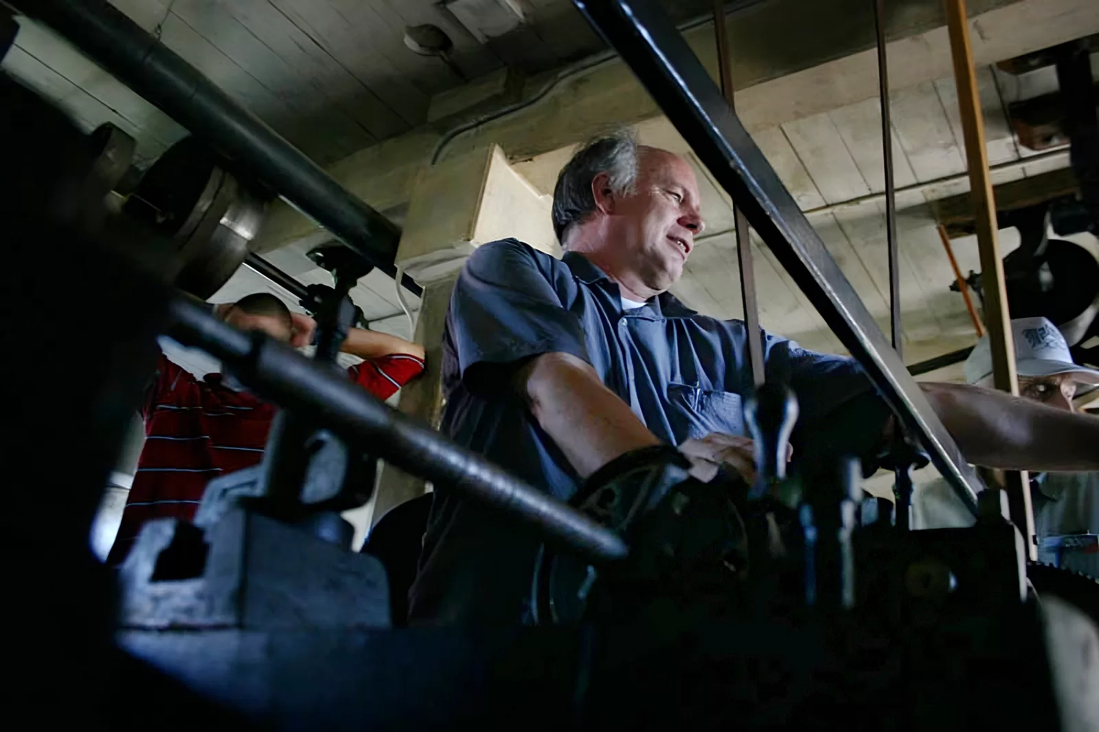 man in museum of machinery