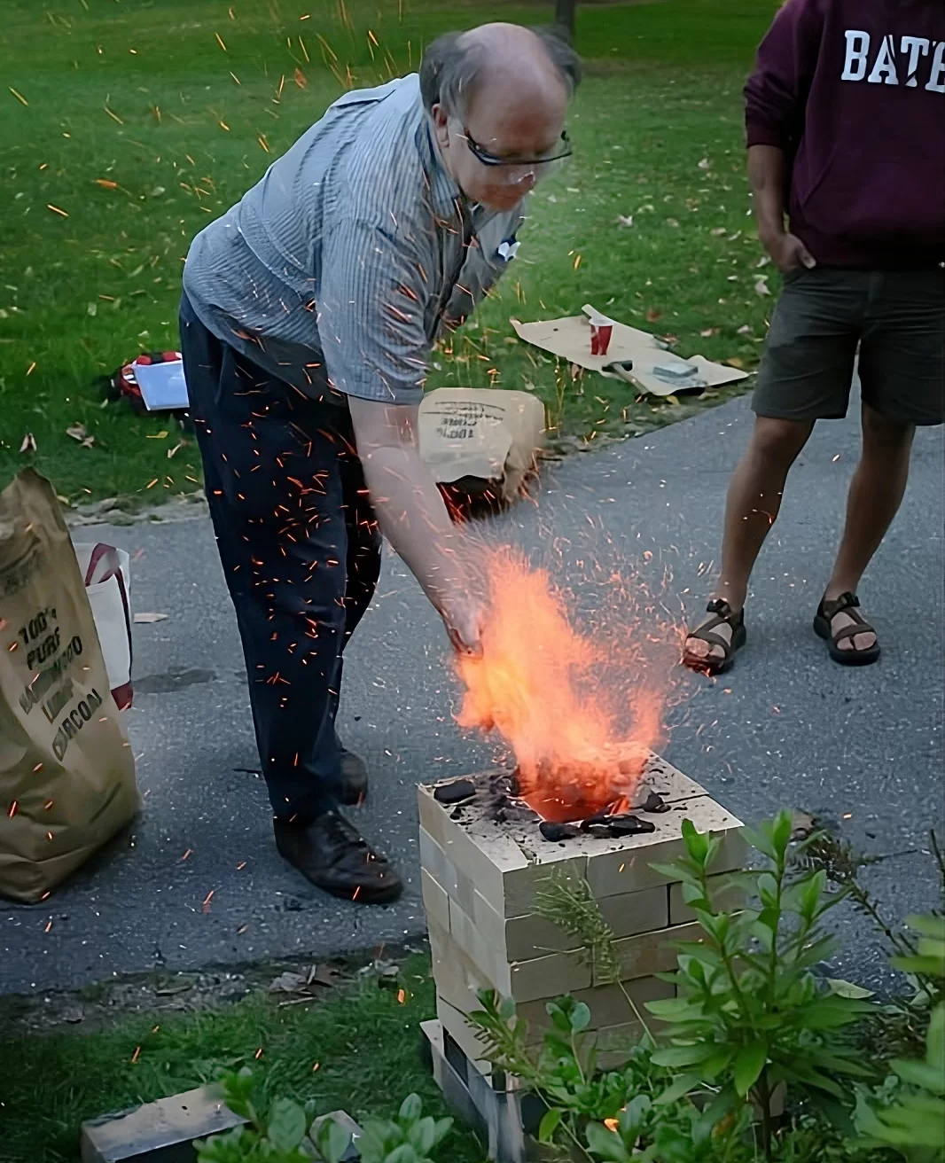 man feeding a stove