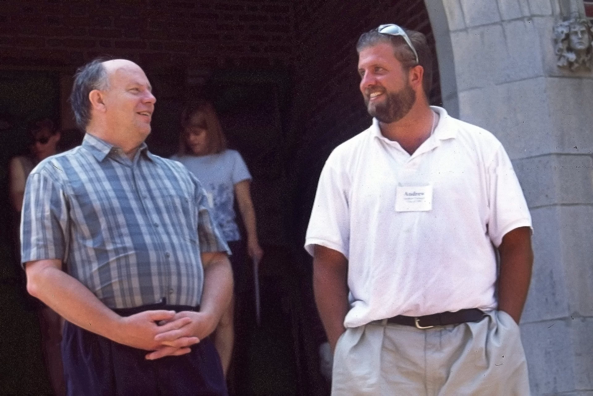 Two men talking outside