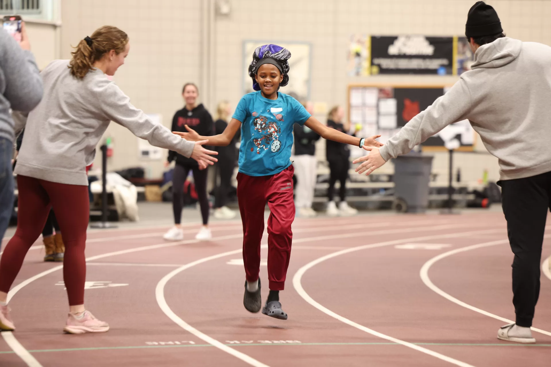 boy running on track