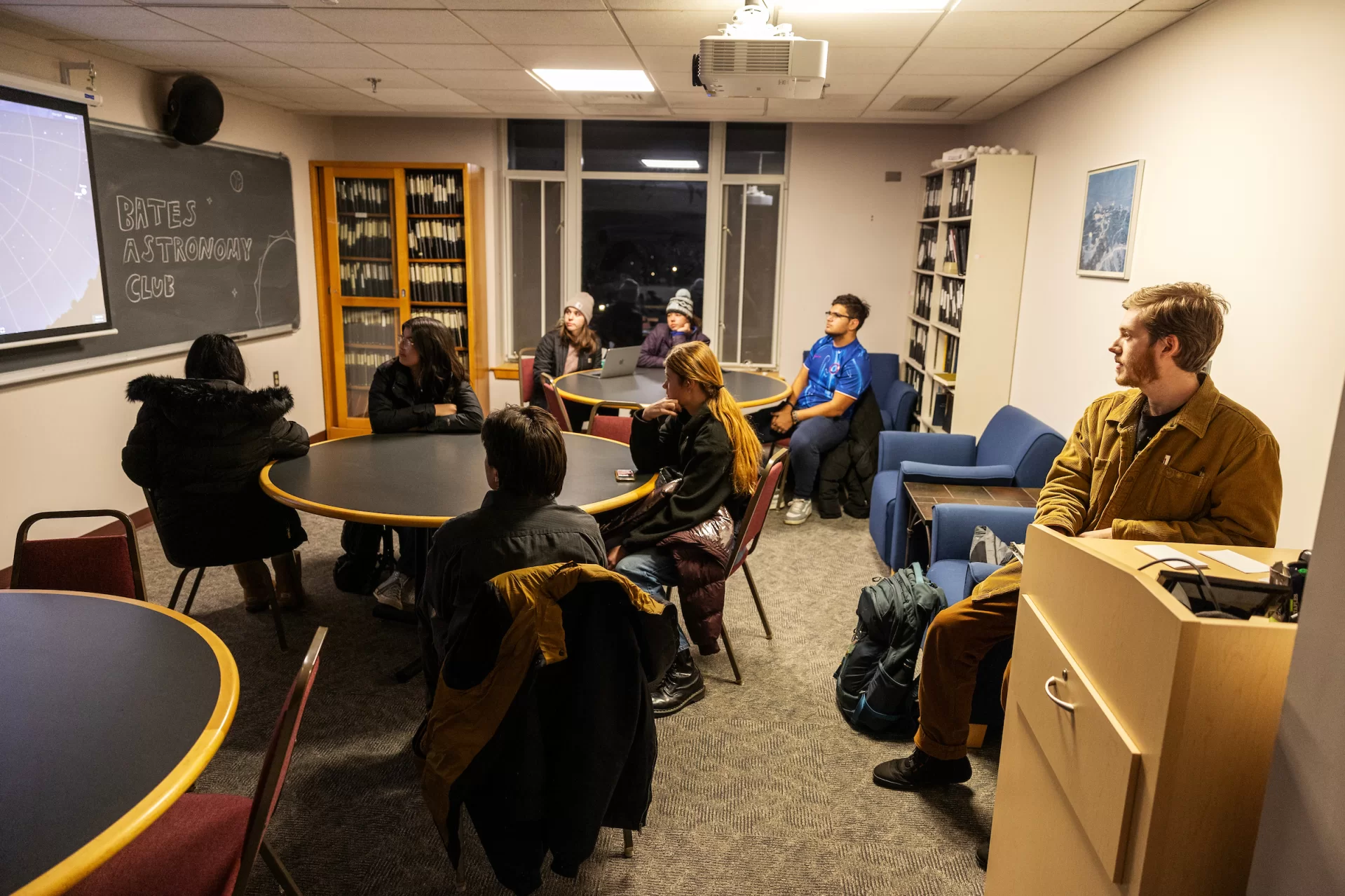 Evan Boxer-Cook ’26, of Scarborough, Maine, leads the Bates Astronomy Club from Carnegie 321 to the Stephens observatory, located on the roof of Carnegie, on January 15, 2025. (Theophil Syslo | Bates College)