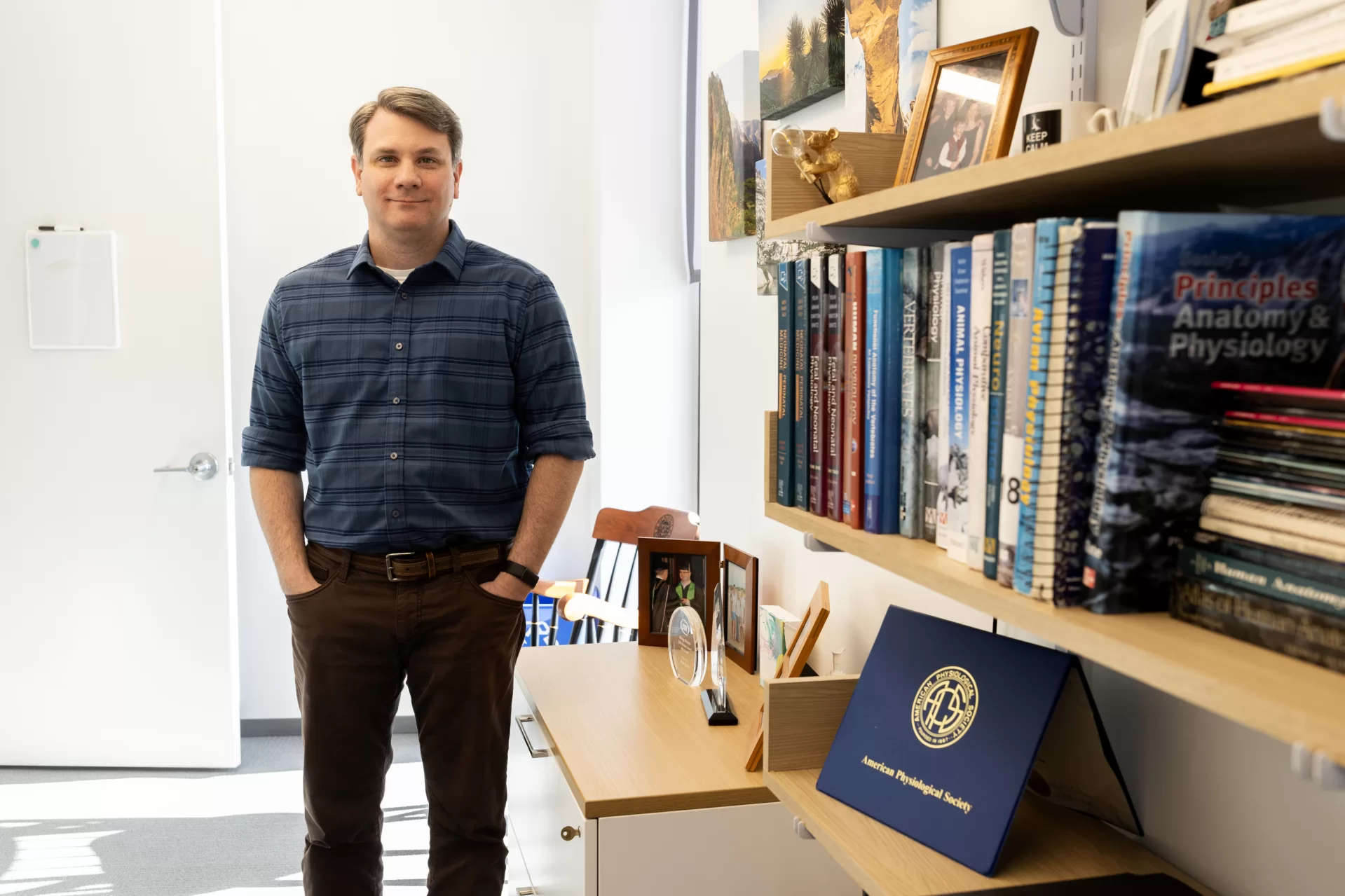 Ryan Bavis, Bates Helen A. Papaioanou Professor of Biological Sciences, posing in his Bonney Science Center laboratory  and office.

Bavis is collaborating with his friend and colleague Peter MacFarlane, assistant professor at the Case Western Reserve University School of Medicine on their discovery of a novel animal model mimicking sudden infant death syndrome. 

Last year, the National Institutes of Health awarded the scientists a $2.8 million grant to study the model over five years. MacFarlane is the project’s principal investigator, and $307,495 is allocated to Bates. Dr. Richard Martin of Rainbow Babies and Children’s Hospital and professor at CWRU’s School of Medicine is also a co-investigator on the project.