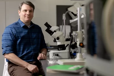 Ryan Bavis, Bates Helen A. Papaioanou Professor of Biological Sciences, posing in his Bonney Science Center laboratory and office. Bavis is collaborating with his friend and colleague Peter MacFarlane, assistant professor at the Case Western Reserve University School of Medicine on their discovery of a novel animal model mimicking sudden infant death syndrome. Last year, the National Institutes of Health awarded the scientists a $2.8 million grant to study the model over five years. MacFarlane is the project’s principal investigator, and $307,495 is allocated to Bates. Dr. Richard Martin of Rainbow Babies and Children’s Hospital and professor at CWRU’s School of Medicine is also a co-investigator on the project.