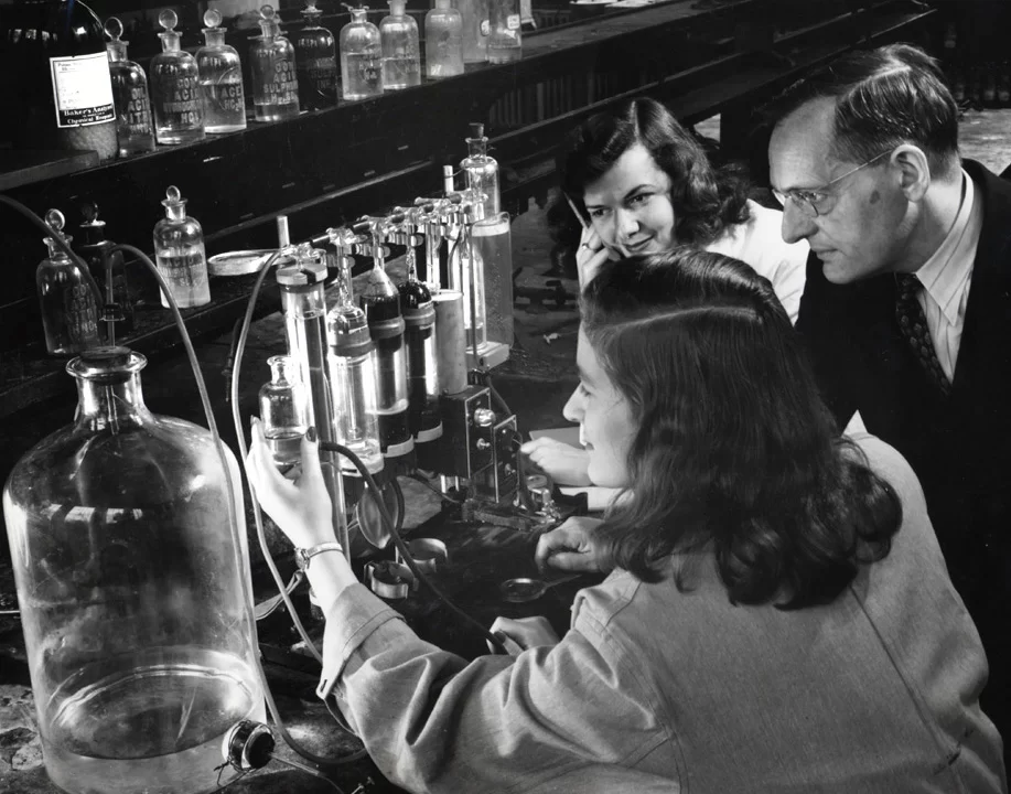 vintage photo of students and professor doing chemistry