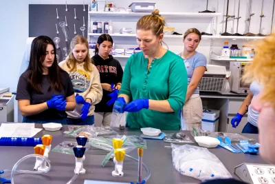 Associate Professor of Biology Larissa Williams teaches students in Bio s39f a lesson on “uses of Genetic analysis to understand the population of dynamics of crabs in Maine.” They met in Bonney 370 laboratory and received instruction on how to use a pipette, including closing their eyes in preparing to click the instrument. The course’s instructor is Jesse Minor ’00, a lecturer in biology.