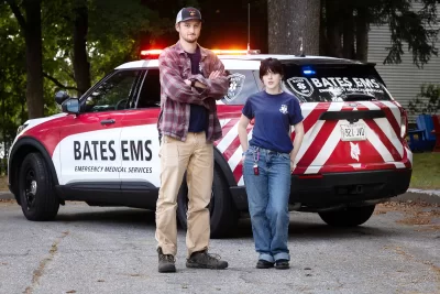 Aoife Spiesel ’26 of South Orange, N.J.,and Noach Bachner ’25 of Weston, Conn., co-presidents of Bates EMS, pose with the organization’s new vehicle in the parking lot behind Campus Safety.