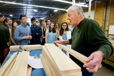 "My introduction to business was through Aristotle." -- Thomas Moser, a master craftsman whose handmade furniture beautifies public spaces around the world, explaining the importance of a liberal arts education. Students in the "Short Term Practicum: Brand Culture Building" (including Lois Masson '16 of Petit-Lancy, Switzerland, and Clarke Shipley '17 of Andover, Mass., pictured here) listened to the internationally acclaimed furniture designer as he offered them a tour of his Thos. Moser Cabinetmakers workshop in Auburn, Maine. Moser, a former speech professor and debate coach at Bates, received an honorary doctor of humane letters from the college in 2015. This course, taught by brand strategist Peter Bysshe '93, takes students behind the scenes of brand culture consultants in an effort to not only humanize intimidating large corporate cultures, but also to arm students with tools to observe, measure, and build, manage or contribute to smaller cultures in which they may find themselves after graduating.