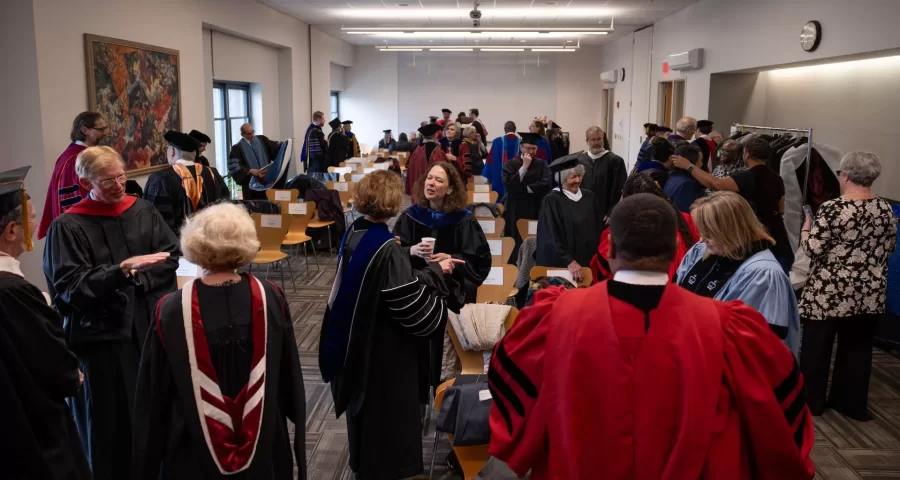 Scenes from inauguration of Garry W. Jenkins, including robing in Commons, installation in Merrill Gymnasium, and Presidential Luncheon on Bardwell Street tents.

As Garry W. Jenkins, Bates College’s ninth president, received the figurative, and literal, keys to Bates’ future as its new leader today, he did so with gratitude, compassion, and determination. 

Before the roughly 1,000 guests in Merrill Gymnasium, Jenkins promised he would lead Bates “with humility and transparency, with tenacity and enthusiasm, and, of course, with ardor and devotion.”

Offering four cornerstones that “will guide our work and propel us forward” and asking the Bates community to “embrace the challenges that await us,” Jenkins emphasized how now more than ever Bates needs to promote teamwork, to remove barriers to students, to become more inclusive, and to cultivate and prepare leaders for tomorrow’s challenges.

By doing so, he said, Bates will become stronger while serving society and democracy. “They rise together.”